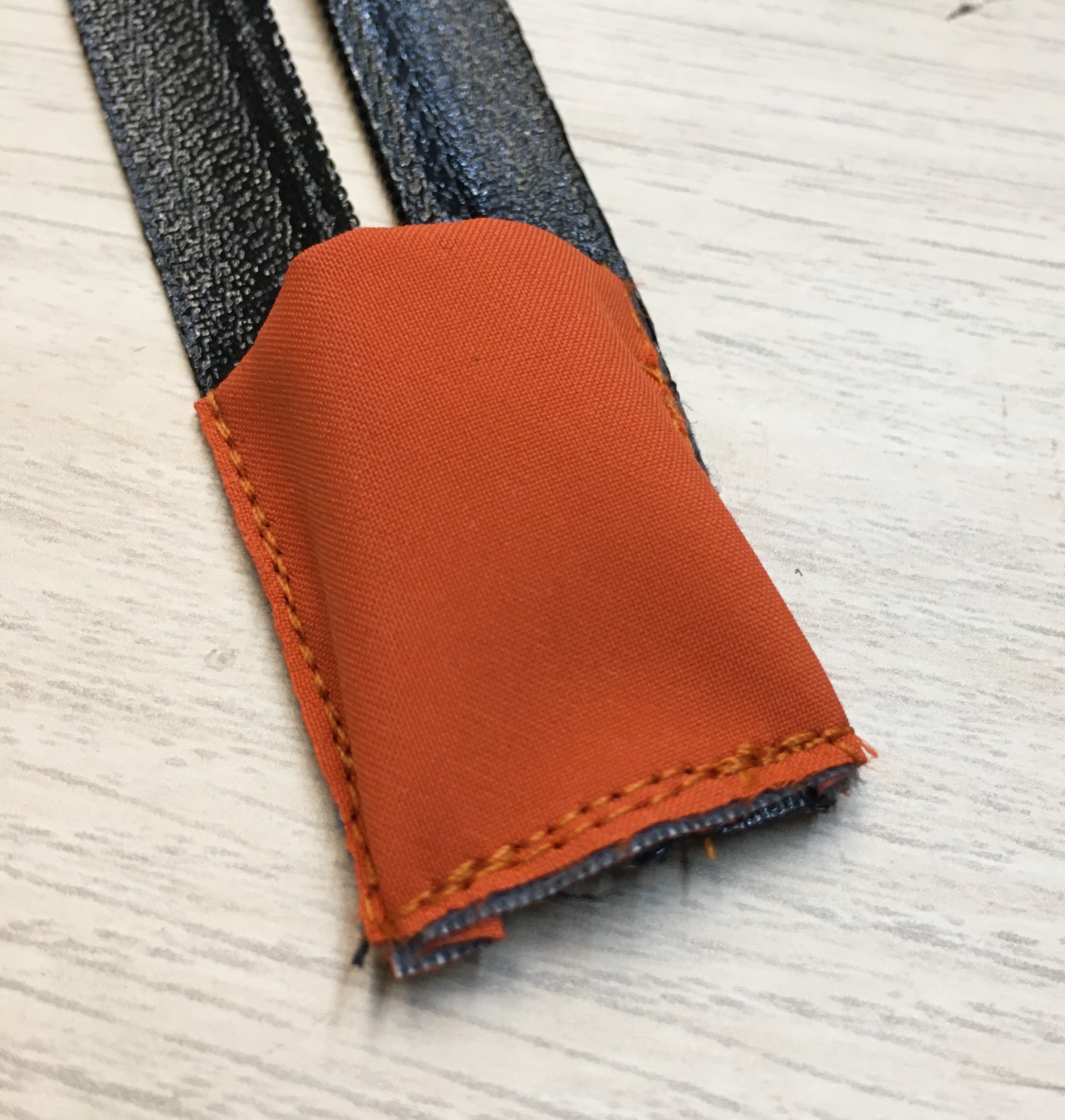 Zipper garage. The orange thread I picked up matched the fabric very well.